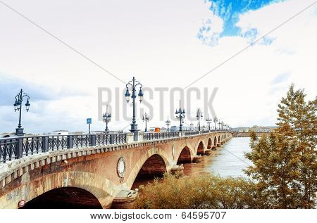 Old stony bridge in Bordeaux, France Europe