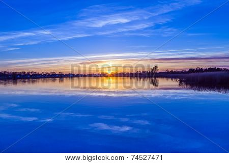 Sunset In Zinnowitz With Reflection On The Water