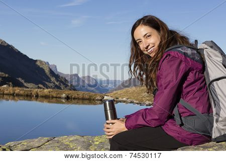 Hiking Woman Making A Pause On Mountain