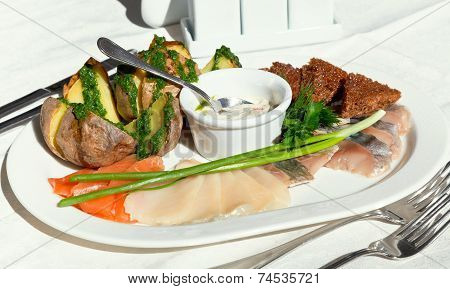 Plate Of Salted Fish With Baked Potato