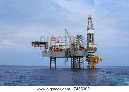 Offshore Jack Up Drilling Rig Over The Production Platform In The Middle Of The Sea - View From Crew