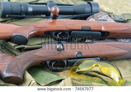 Set of different guns on background for shooting
