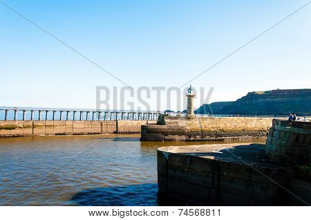 Scenic view of Whitby Pier in sunny autumn day, UK