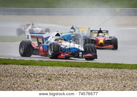 ASSEN, NETHERLANDS - OCTOBER 19, 2014: Team Slovenia in the lead of the Formula A1 GP division during a wet race on the TT circuit, Assen