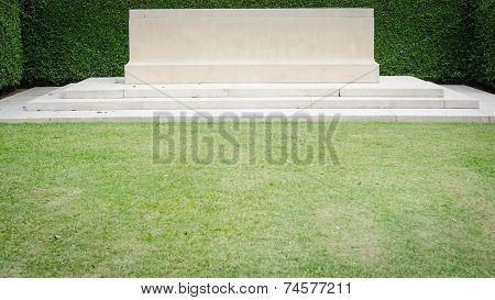 The blank great headstone on green grass