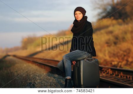 Girl Sitting On A Suitcase