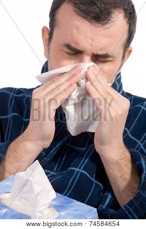 sick man blowing his nose