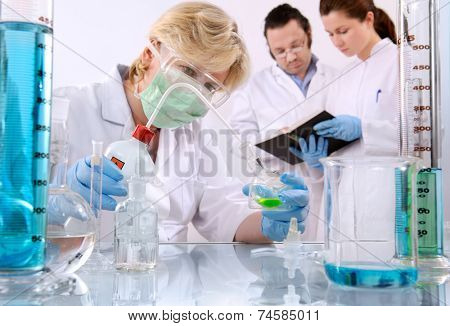 group of scientists working at the laboratory