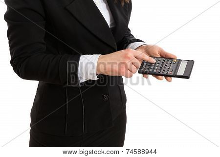 Woman in suit holding a calculator and pressing a button