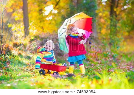 Brother And Sister In An Autumn Park