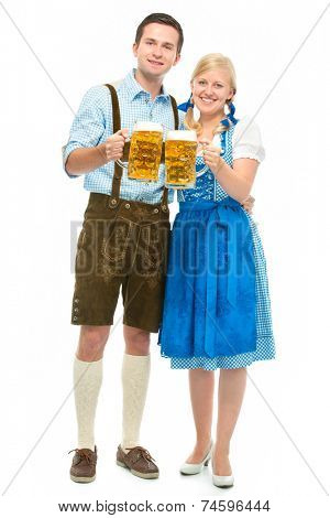 happy bavarian couple in dirndl with oktoberfest beer