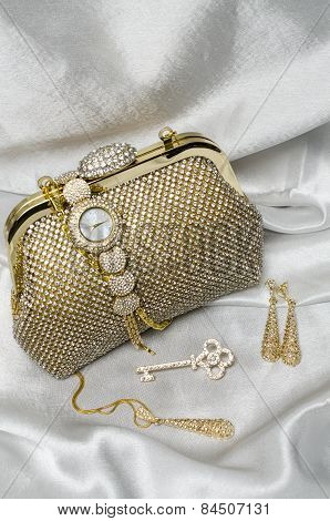 Set Of Women's Accessories On A White Silk Background