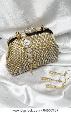 Set Of Women's Accessories On A White Silk Background