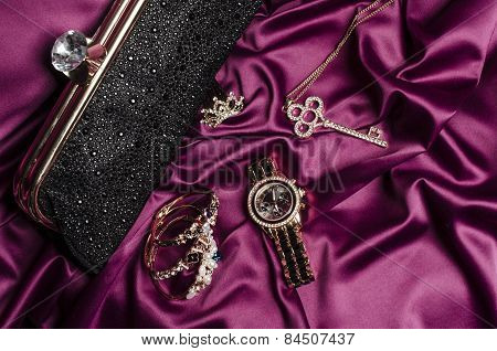 Set Of Women's Accessories On A Silk Background