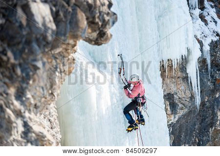 Mountaineer Ascends The Vertical Icefall With Ice Picks