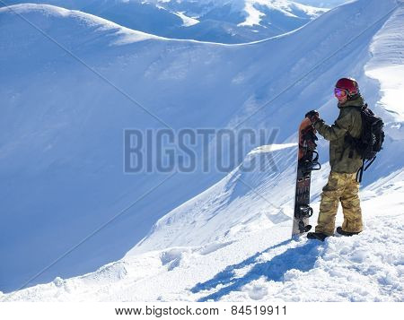 Snowboarder With Splitbord In The Mountains.