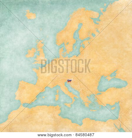 Slovenia (Slovenian flag) on the map of Europe. The Map is in vintage summer style and sunny mood. The map has soft grunge and vintage atmosphere which acts as watercolor painting on old paper.
