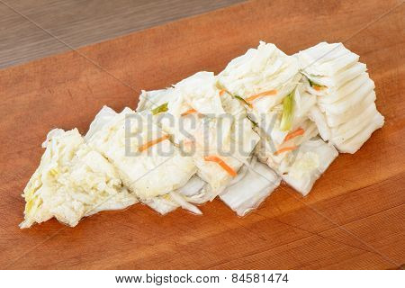 Cutted White Gimchi On A Wooden Plate