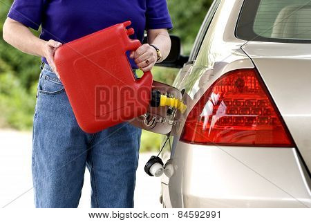 Adding Gasoline To Car Gas Tank