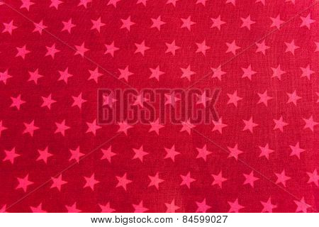 Pink stars on red background