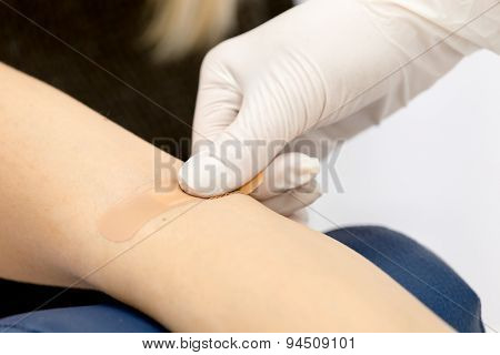 Patch on the arm after taking blood from a vein