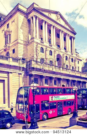 LONDON, UK - JUNE 30, 2014: Bank of England. Square and underground station with red bus on foregrou