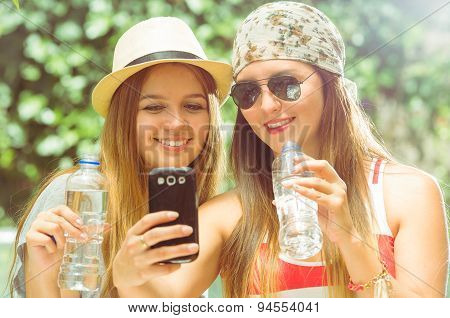 Hipster girls posing outdoors