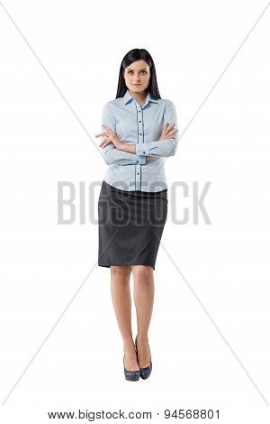 Full Length Of The Brunette Girl With Crossed Hands.