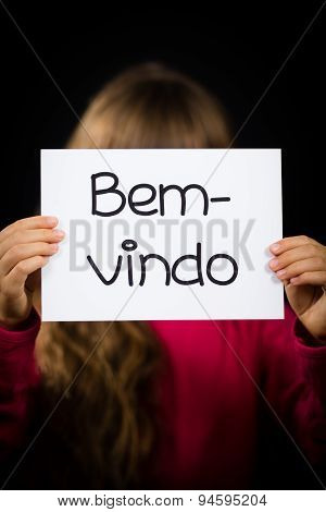 Child Holding Sign With Portuguese Word Bem-vindo - Welcome
