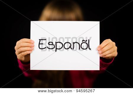Child Holding Sign With Spanish Word Espanol - Spanish In English