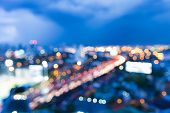 Twilight of blur bokeh lights city highway during busy hours