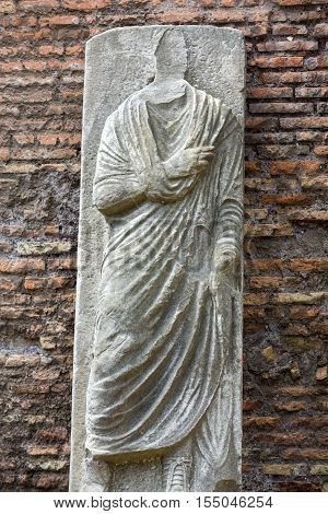 The ancient statue in the baths of Diocletian (Thermae Diocletiani) in Rome. Italy