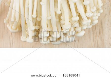 enokitake on the cutting board isolated on white background.