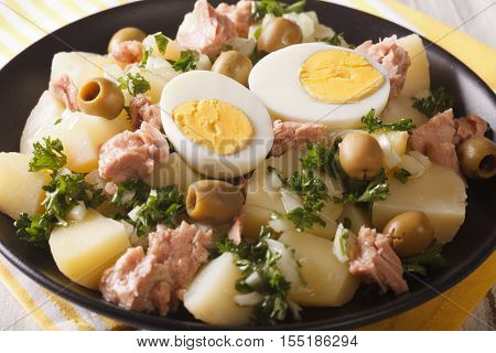 Spanish Salad Patatas Alinadas Of Boiled Potatoes With Tuna, Egg And Olives Close-up. Horizontal