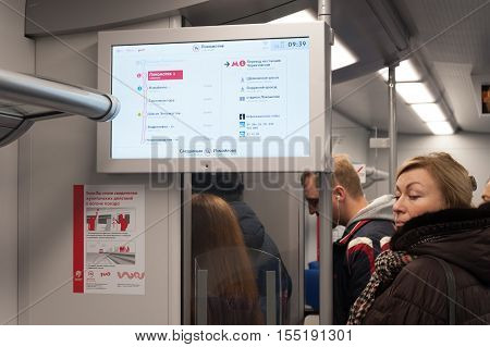 MOSCOW - NOVEMBER 1: Electronic display wall banner and passengers at 