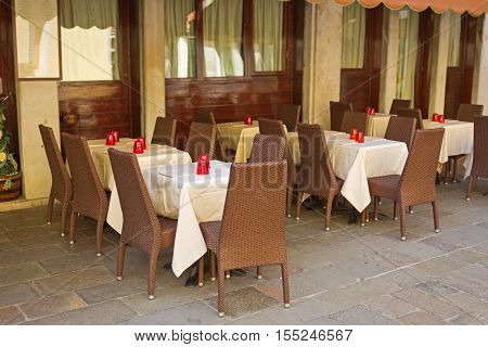 Typical italian outdoor places of the cafe neatly served