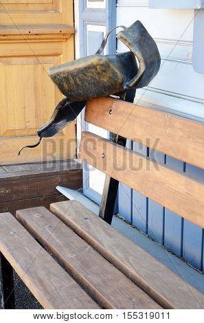 Irkutsk, Russia - May, 22 2016: Sculpture Of Men Winter Hat With Earflaps On The Bench In Irkutsk St
