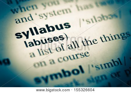 Close Up Of Old English Dictionary Page With Word Syllabus