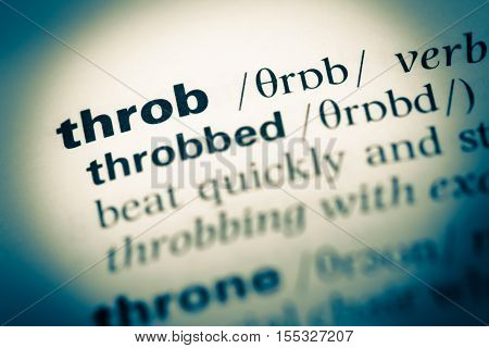 Close Up Of Old English Dictionary Page With Word Throb