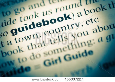 Close Up Of Old English Dictionary Page With Word Guidebook