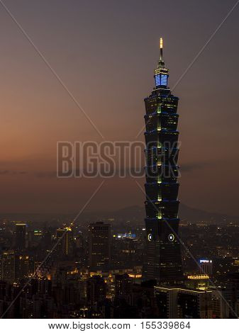Sunset of cityscape nightlife view of Taipei. Taiwan city skyline at twilight time public scene from view point at Elephant Mountain Hiking Trail.