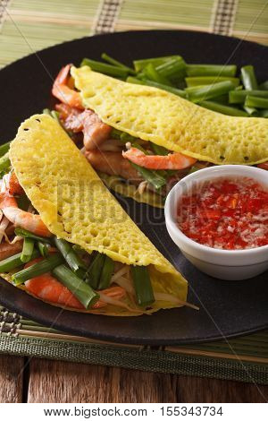 Banh Xeo Crepes Stuffed With Pork, Shrimp, Onions, Bean Sprouts And Spicy Sauce Closeup. Vertical