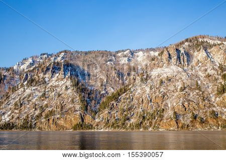 Winter landscape in Siberia. The ridge of the Eastern Sayan near the town of Divnogorsk