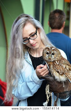 Slovakia Bojnice 2016 july 3 Young girl with an owl on hand
