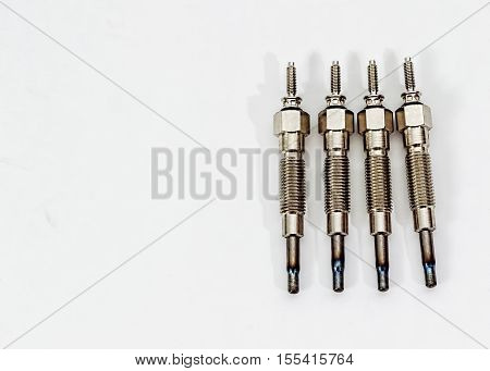 Auto Parts. Spare parts for the repair of cars. Glow plugs in on a white background isolated.