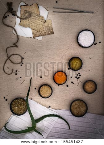 Alchemy Lab. dried herbs, salt, flasks, pipettes recipes on the old canvas