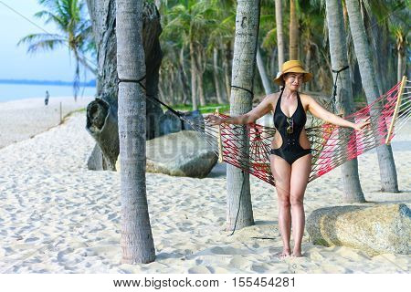 Lady happy sunshine in Ban Krut Beach at Prachuap Khirikhun Province Thailand