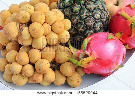 southern langsat and Dragon fruit close up on plate