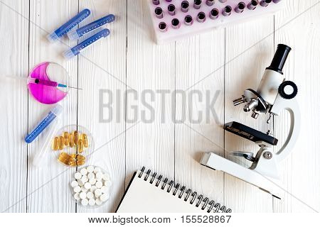 workplace lab assistant with microscope at the clinic top view no one