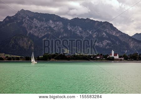 Boats and panoramic views of Forggensee lake Germany